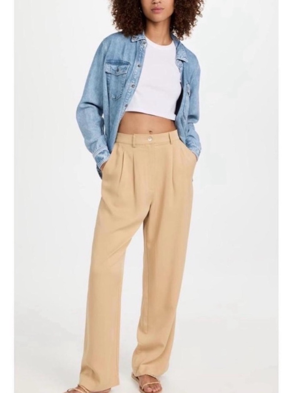 DONNI. High-Rise Wide-Leg Pleated Pants in Beige